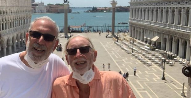 Happy clients enjoy the amazing terrace views from St Mark's Basilica, Venice, Italy