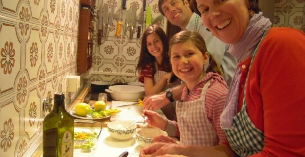 Smiley clients enjoying an hands-on family friendly cooking class in Rome, Italy